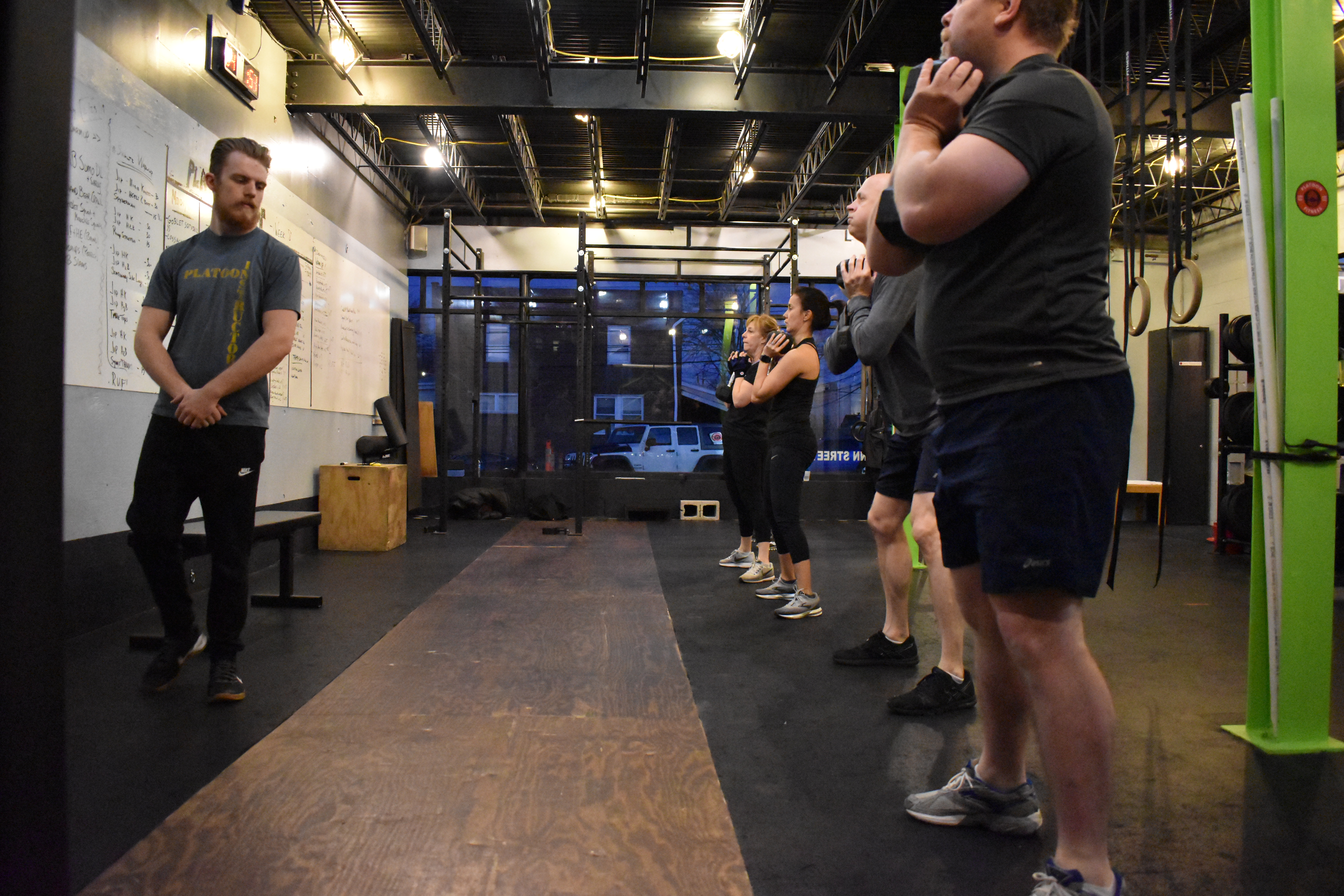 A group of people standing in a gym