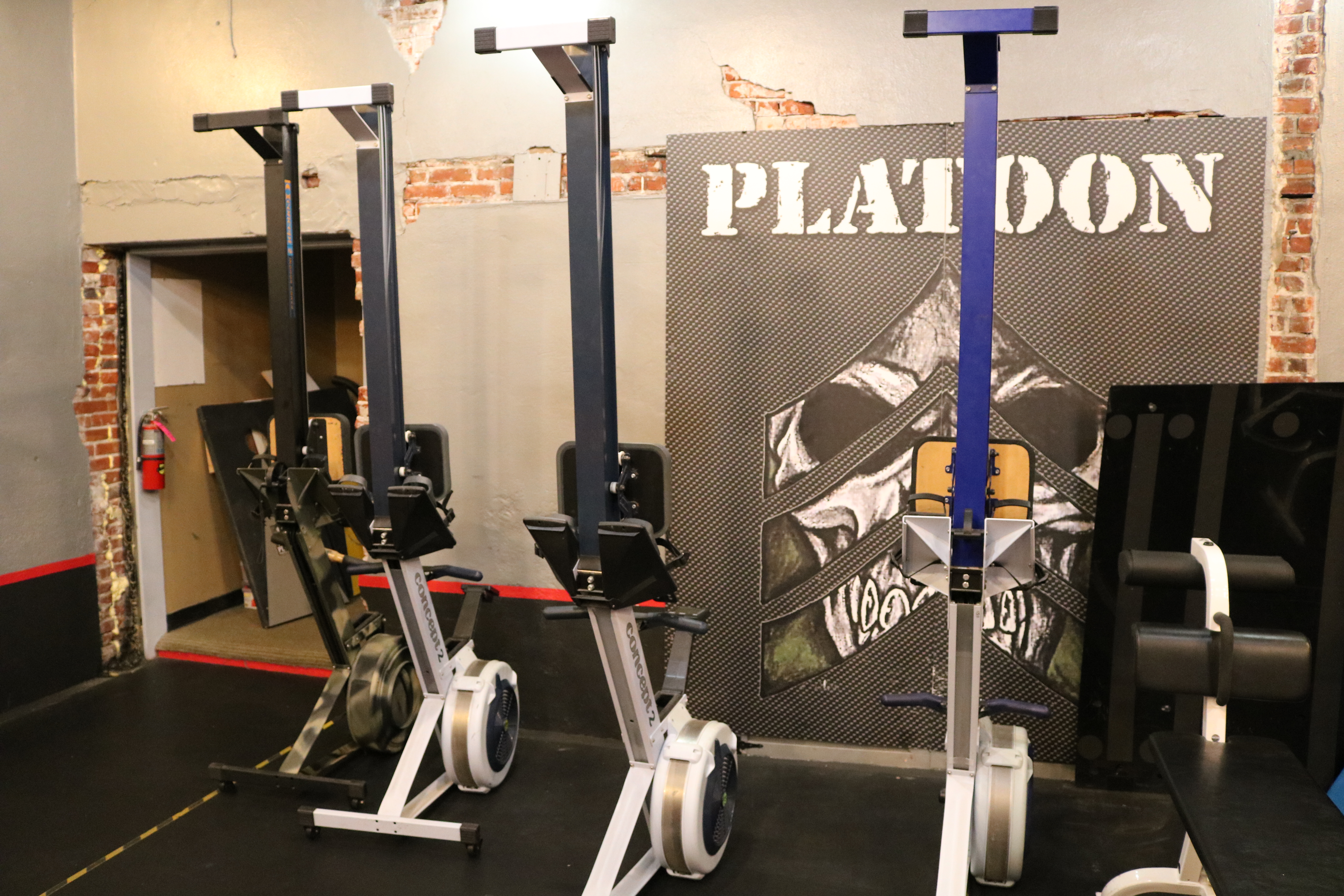 Three different types of exercise equipment in a room.