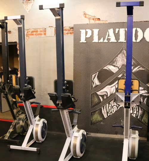 Three different types of exercise equipment in a room.